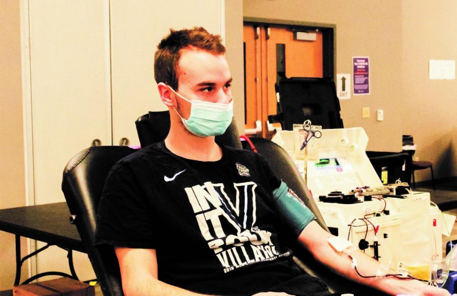 Student Preston Pagel donates blood at the Community Engagement Center Feb. 10. 

