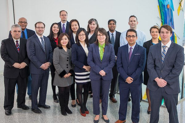 The UW-Whitewater Department of Economics poses for a department photo in the Atrium of Hyland Hall on March 6, 2020. From left: Russ Kashian, Daniel Teferra, Matthew Winden, Heather Rasmussen, Jeffery Heinrich (at back), Yunsun Huh (front), Ran (Nancy) Tao, Yuhan (Cathy) Xue, Marianne Hayek, Krastina Dzhambova, Yamin Ahmad, David Welsch (back), Narendra Regmi (front), Eylem Ersal, Nicholas Lovett. (UW-WHITEWATER PHOTO/NICK POOK)