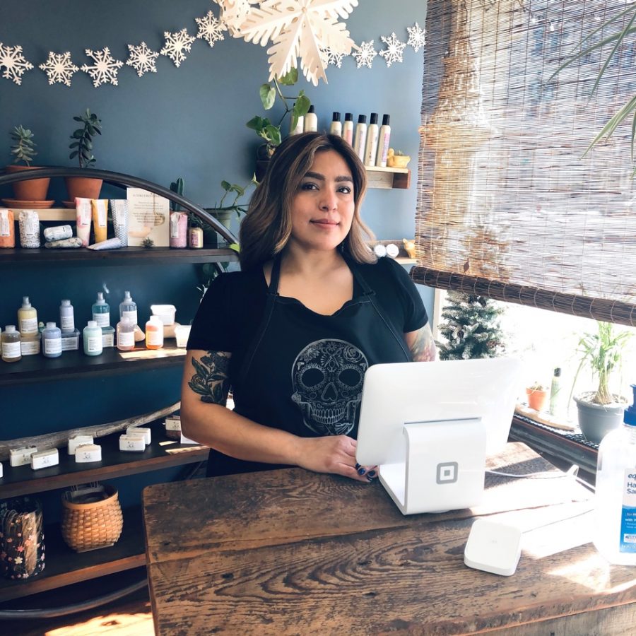 Botanica Beauty Parlour owner Jennifer Zamora welcomes clients at the front desk of her new establishment on Main Street in downtown Whitewater. 