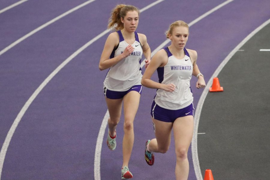 Jill+Cavanaugh+%28left%29+and+Amanda+Leder+compete+in+the+one+mile+run%2C+during+the+warhawks+track%0A%26+field+meet+against+UW-Oshkosh.