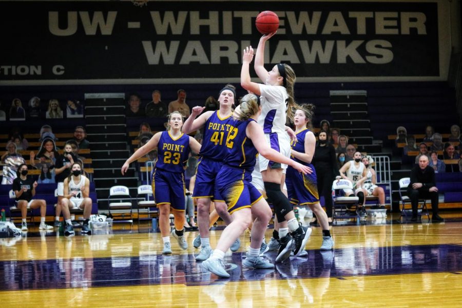 Sophomore forward Aleah Grundahl (33) jumps up to go for a basket during UW-Whitewater’s game against UW-Stevens Point. Grundahl (33) finished the game with a team high 16 points.