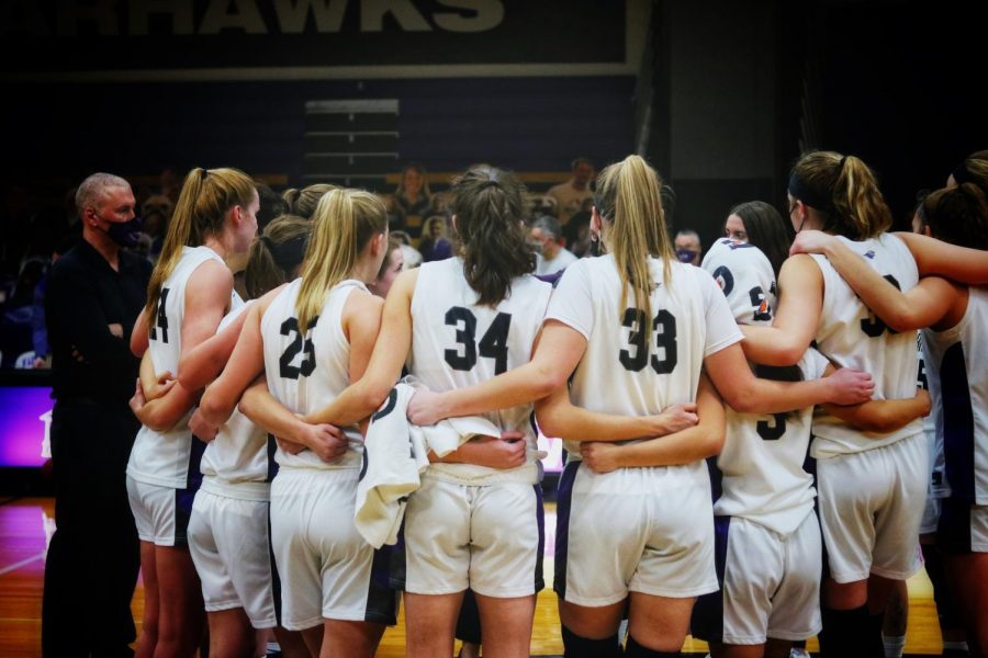 The University of Wisconsin-Whitewater women’s basketball team huddles up as the game comes to a close on senior night Friday, Feb. 26.