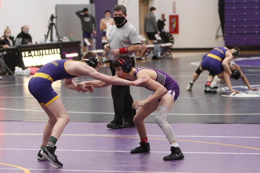 UW-Whitewater freshman wrestler John Fortugno (right) competes during a match against UW-Stevens Point Friday Feb. 5. 