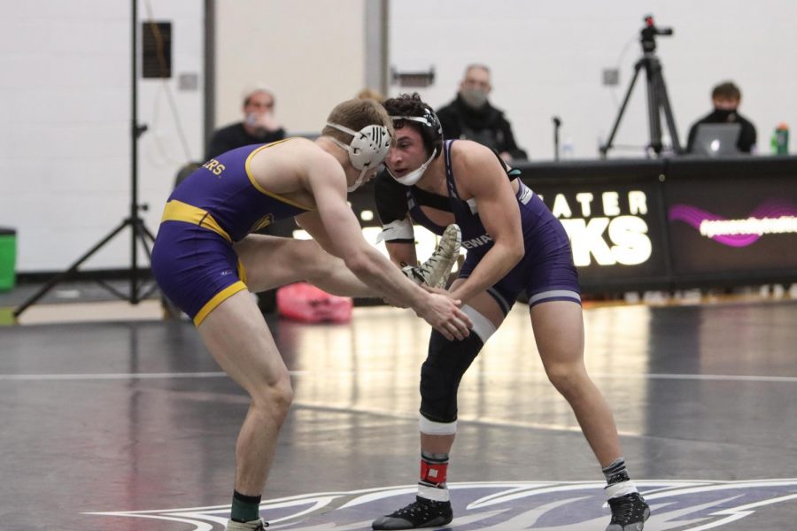 UW-Whitewater freshman wrestler Isaiah Mohmed (right) competes during a match against UW-Stevens Point Friday Feb. 5. 