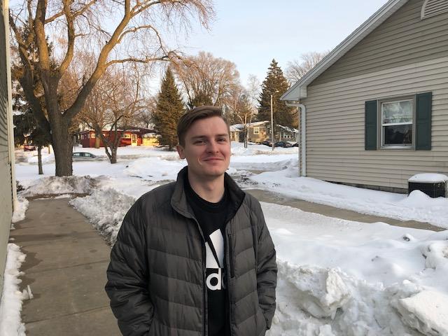 UW-W senior finance major Ben Nackel takes a walk down the streets of Whitewater on a sunny winter day. 