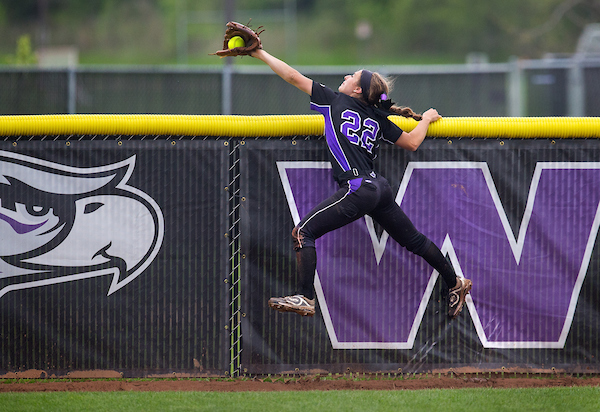 UW-Whitewater outfielder Caitlin Catino goes skyward to make a spectacular catch before the ball can go over the outfield fence during a regional championship game on Monday, May 14, 2018 against Coe (Iowa). The Warhawks won the game 3-2 to advance to the Super Regional.