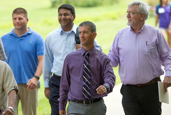 Dean John Chenoweth, center, and faculty from the College of Business and Economics arrive at Young Auditorium for the State of the University Address.  The new academic year opened at UW-Whitewater with the Chancellors State of the University address preceded by a breakfast for new staff, on Monday, August 29, 2016.  (UW-Whitewater photo/Craig Schreiner) DIGITAL MANIPULATION OF PHOTOGRAPHS OTHER THAN NORMAL MINIMAL CROPPING AND TONING IS PROHIBITED., CREDIT PHOTOS: UW-WHITEWATER PHOTO/CRAIG SCHREINER