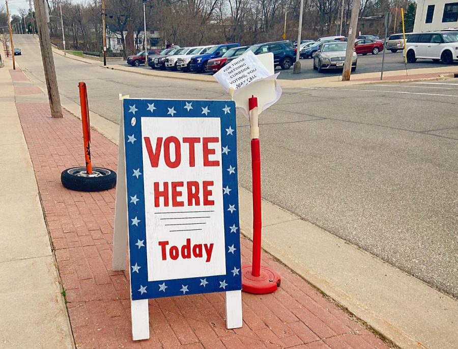 Outside the Whitewater Armory Gym stands a sign telling Whitewater residents to vote.