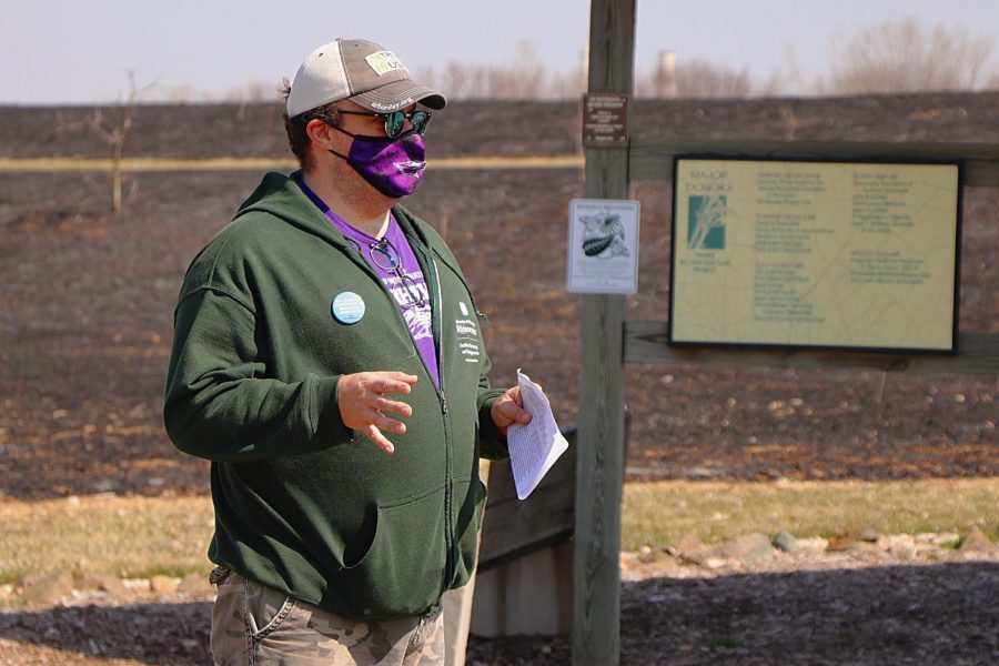 Sustainability Director Wesley Enterline guides attendees of the University of Wisconsin Whitewater Sustainabilty hosted event through the campus Nature Perseve in a mindful prairie walk, Saturday, April 3.