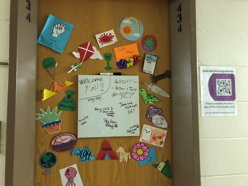 Scott Nadolinski's door decor includes a white board for friends to leave fun messages in Tutt Hall. 