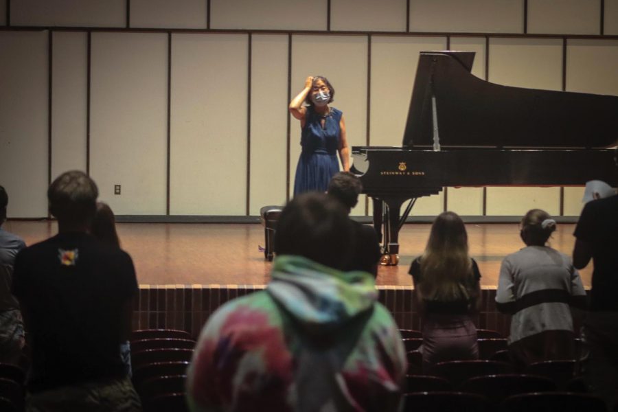 Dr. MyungHee Chung stands and bows finishing their performance Music Musics while the audience gives them a standing ovation located in the Light Recital Hall inside the Center of the Arts, Friday, Sept. 17, 2021.