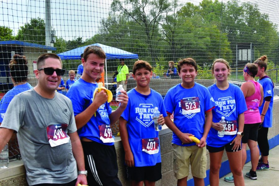Whitewater Middle School Associate Principal Ben Holzem cools off after the run with # 490 Ben Holzem, # 493 Tyler Hansel, # 401 Isaiah Mendez, # 523 Cristian Aranda and # 481 Madeline Hefty. 