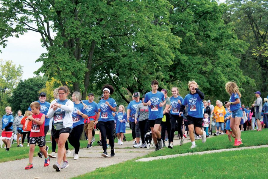 Runners take off at Treyton’s Field of Dreams to begin the 11th Annual Run for Trey in Whitewater, Wisconsin Oct. 10, 2021.