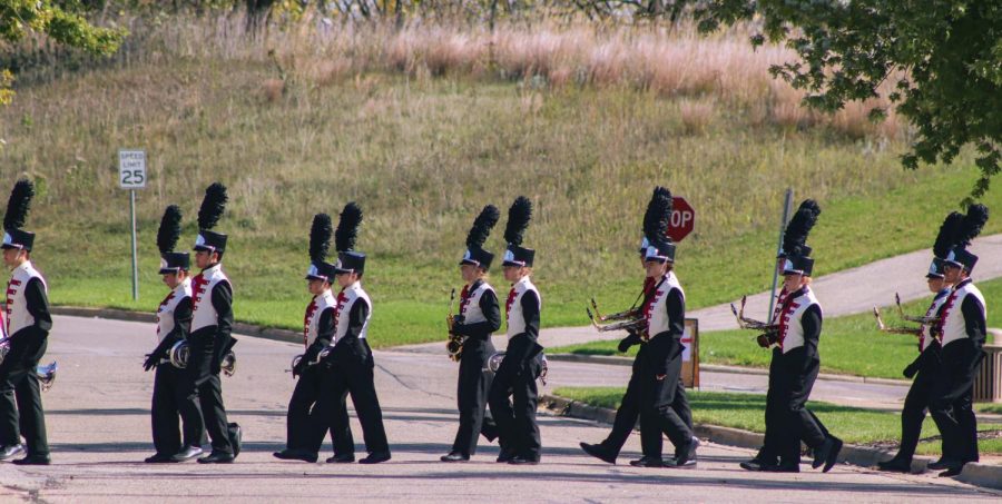 Band competitors cross Warhawk Drive for the Wisconsin School Music Association State Competition held in Whitewater, Saturday Afternoon, Oct.16, 2021.