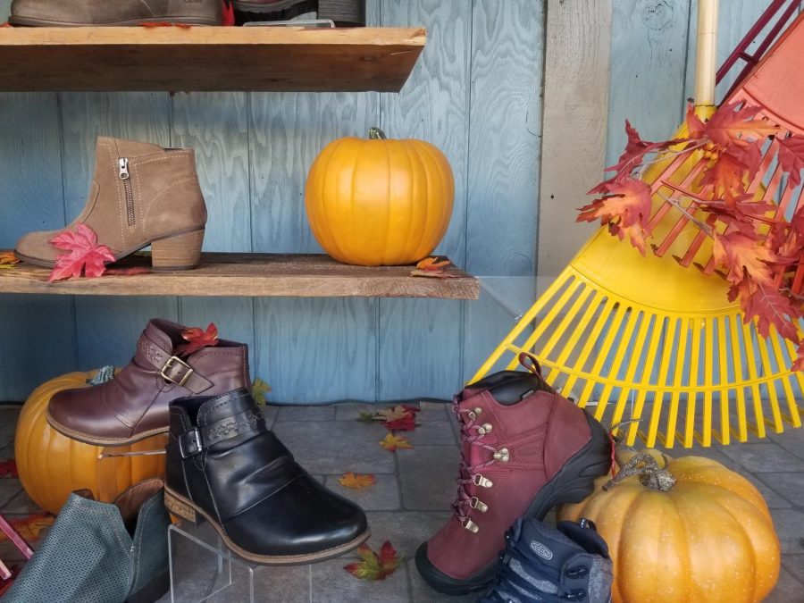 A range of new and stylish boots displayed in the window of Dale’s Bootery in downtown Whitewater.