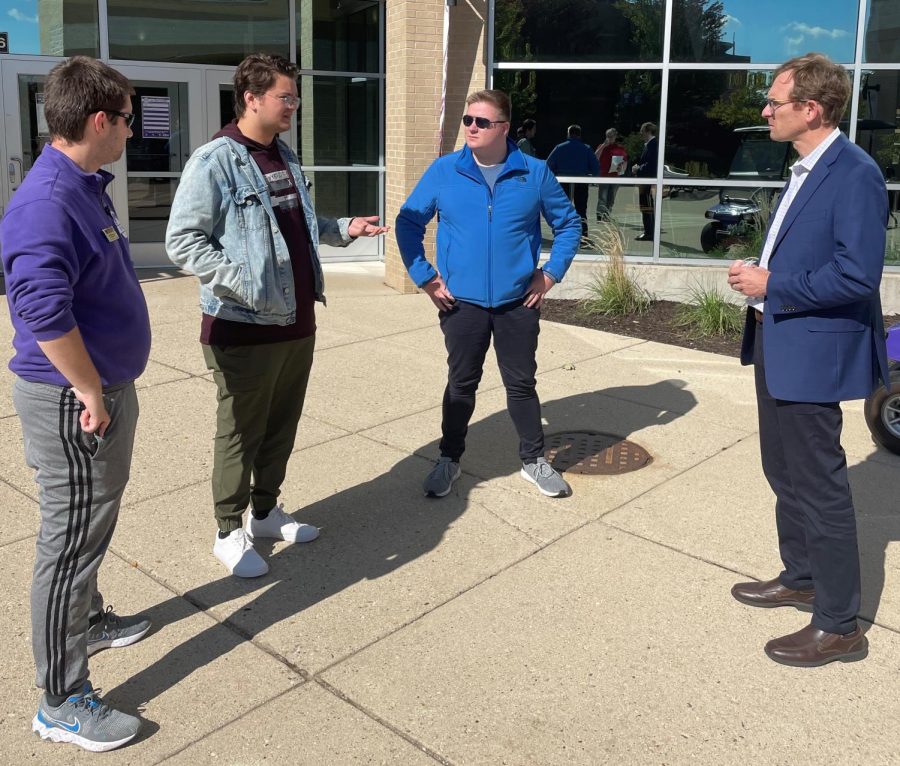 Whitewater Student Government Speaker Justin Wesolik, Student Body President Davin Stavroplos and Director of Student Affairs Will Hinz talk to Senate candidate Tom Nelson (D) outside the University Center Oct. 16, 2001. 