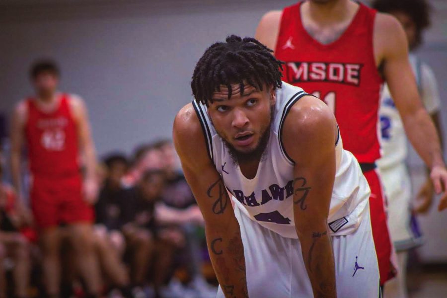 Freshman guard Derek Gray (4) takes a brief breather before getting back into the game Saturday evening Nov. 27, 2021.