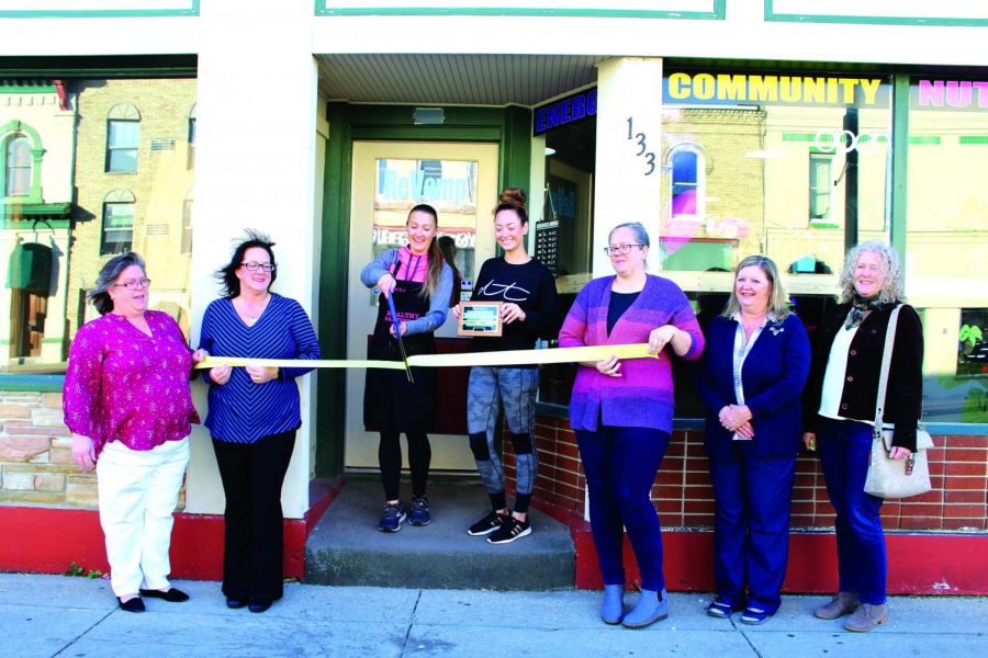 Owner Jericca Newby cuts the ceremonial ribbon for her brand new business, ReVamp Nutrition that is located on West Center Street, Whitewater on Nov. 8, 2021.