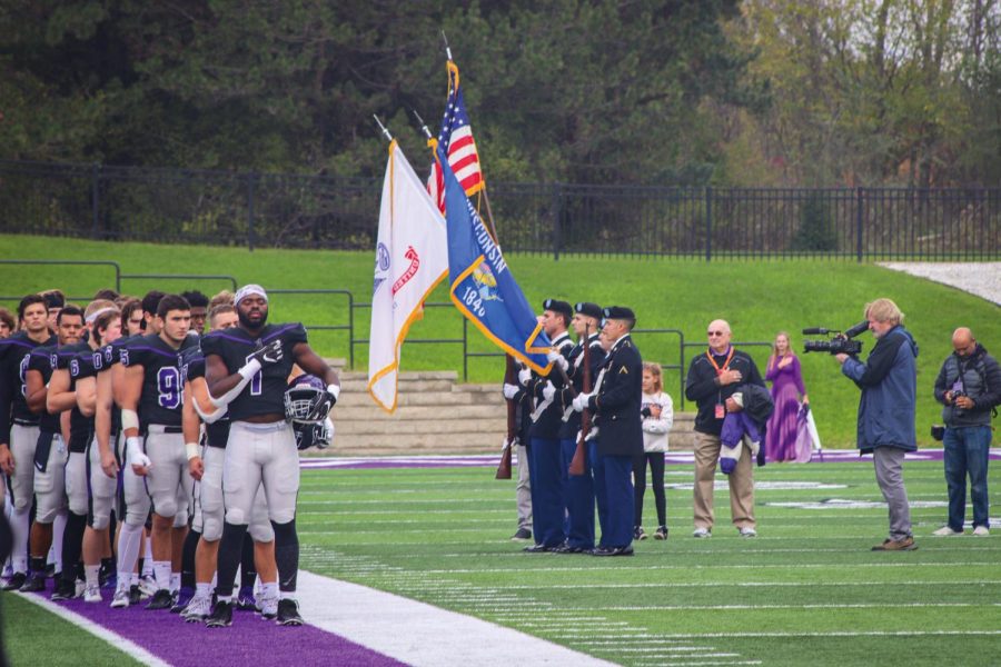 Senior defensive line Mackenzie Balanganayi (1) puts his hand on heart during the national anthem before the home football game Saturday, Oct. 30, 2021.
