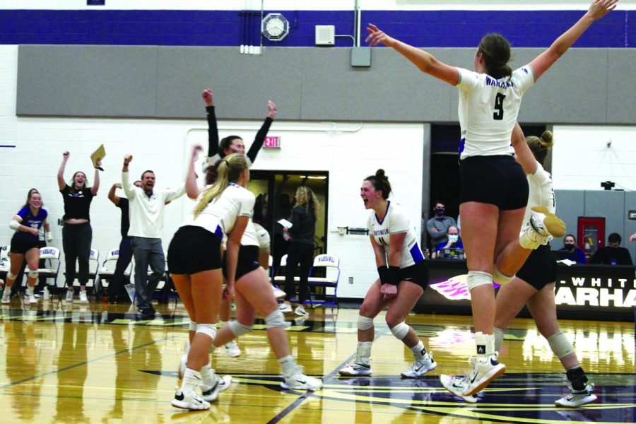 The+UW-Whitewater+volleyball+team+celebrate+a+hard+earned+win+over+UW-Stevens+Point%2C+on+Nov.+4%2C+2021+in+the+Williams+Center%2C+to+move+onto+the+final+round+of+the+WIAC+tournament.