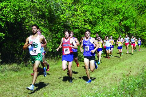 Freshman Christian Seagren tries to overtake several runners during the Tom Hoffman Invitational meet in Whitewater on Sept. 18, 2021. 