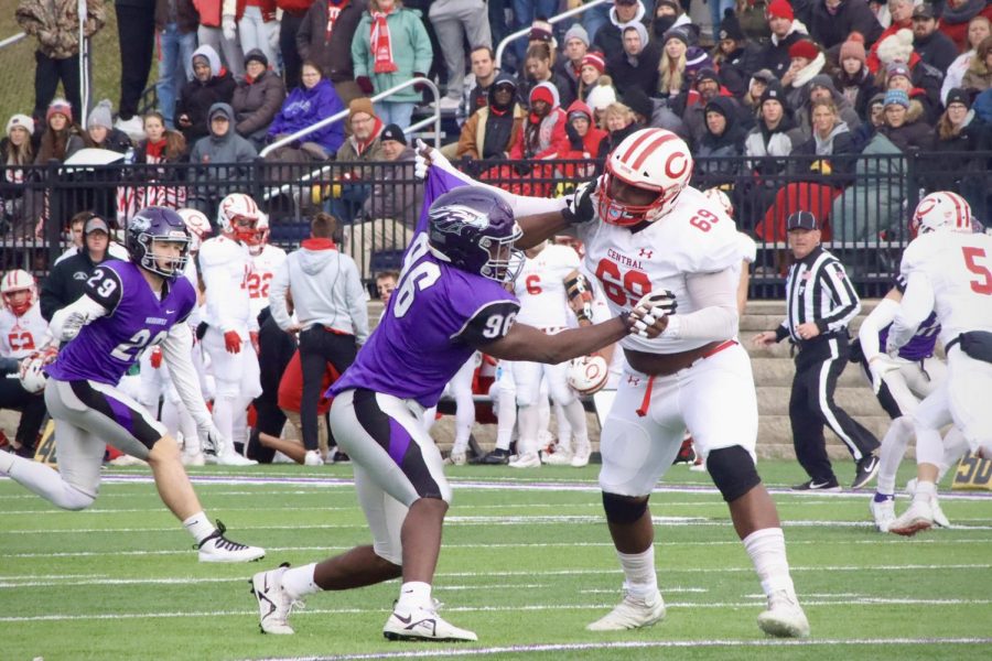Sophomore defensive line Justin Allen (96)and opposing team junior offensive lineman Que Baker- McCauley(69) push against each other during the game against Central University Saturday afternoon Dec. 4, 2021.