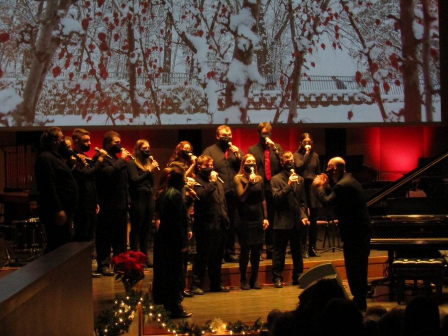 The Vocal Jazz ensemble, directed by Dr. Michael Hackett, are seen here singing their piece 