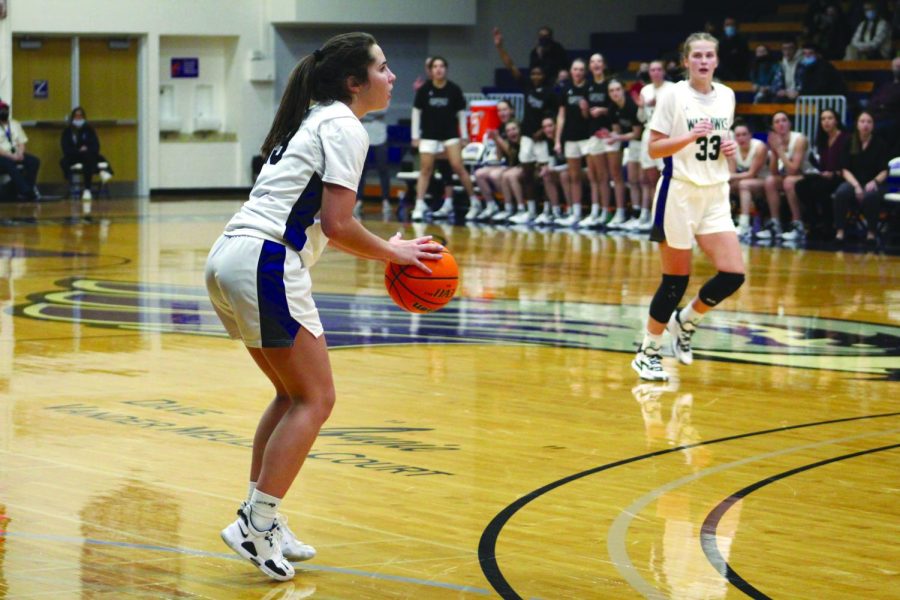 Freshman guard number 13 Kacie Carollo looks to make a basket against the University of Wisconsin - Stevens Point during their home game on Jan. 26, 2022.