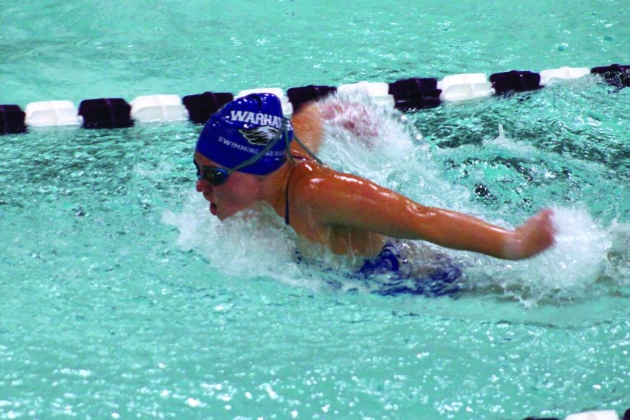 Senior Abby Thompson looks toward the end of her two hundred-yard butterfly event in Whitewater Jan. 22, 2022.