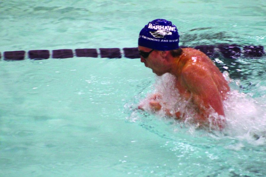 Senior Tyler Popke is determined to finish strong in his heat of the one hundred-yard breaststroke in Whitewater on Jan. 22, 2022.