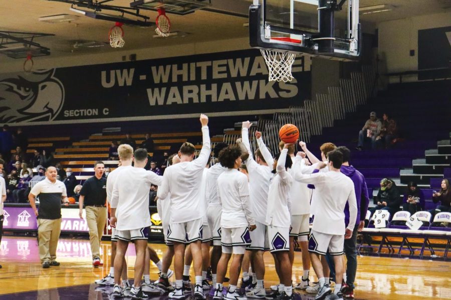 The Warhawks Men’s basketball team huddles and cheers together before the game against the
University of Whitworth Saturday, Nov. 13. 2021.
