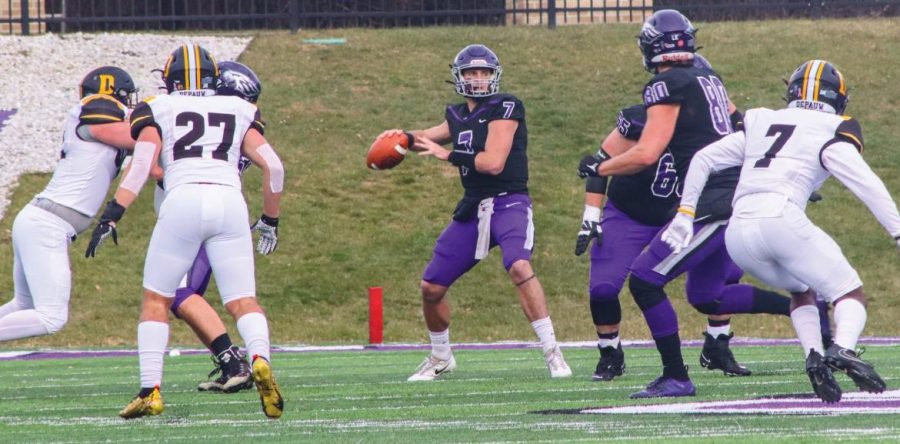 Senior quarterback Max Meylor gets ready to throw the ball to another team member during the game against DePauw University Saturday, Nov. 27, 2021. 