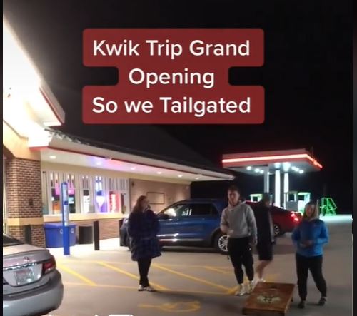 A screenshot of the viral TikTok video showing UW-Whitewater students playing cornhole in the Kwik Trip parking lot to celebrate the grand opening of the Elkhoen Road location Dec. 9, 2021.