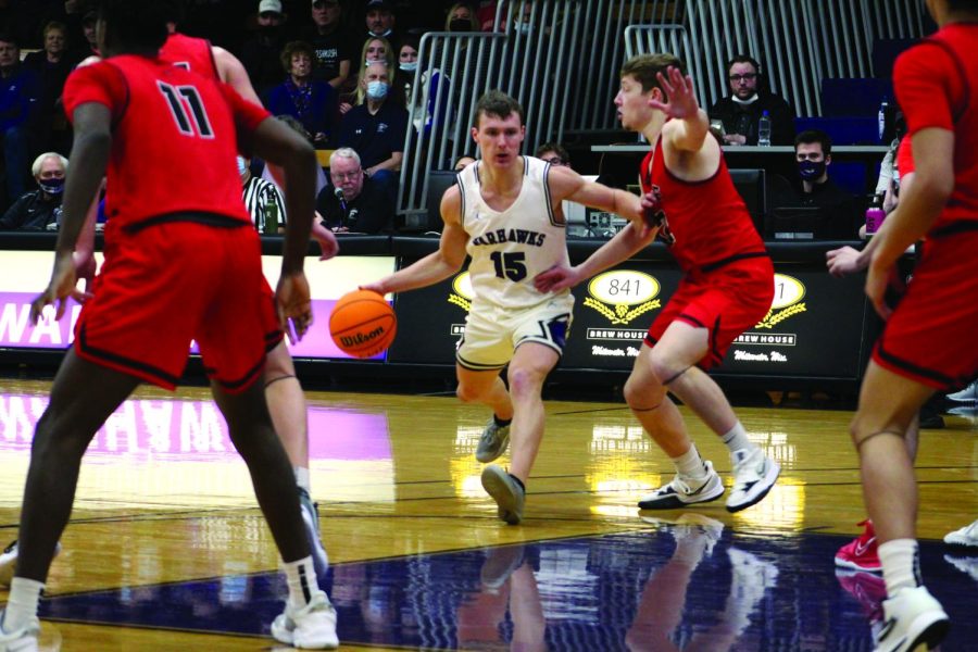 Freshman guard JT Hoytink makes a drive toward the basket against the University of Wisconsin - River Falls in the Kachel Gymnasium Jan. 22, 2022.
