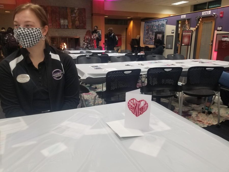 UC Manager Anna Cernohous, waits patiently at the sign in desk for students to arrive and make their Valentines day cards.
