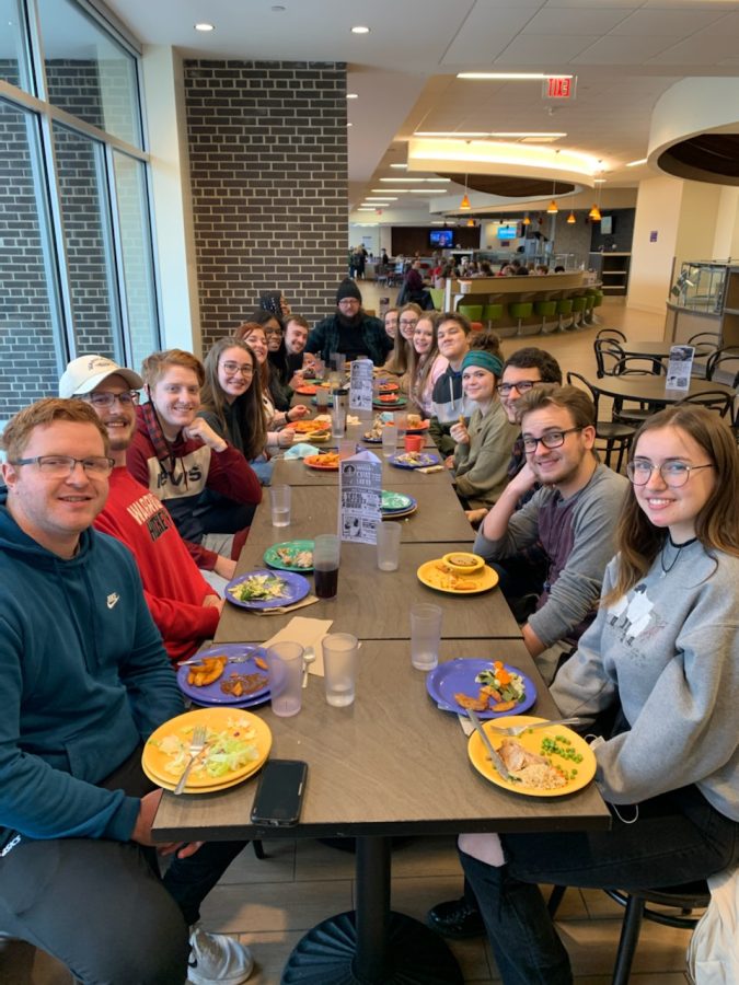 In the midst of 2022 Spring training, the Wells East staff eats dinner at Drumlin Dining Hall with RJ Mitchell at the head of the table.
