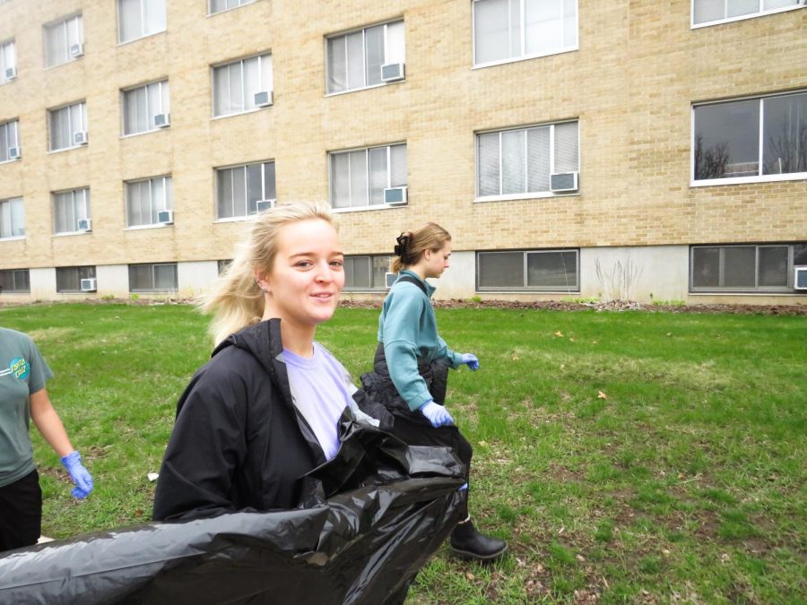 McKenzie Dopak and Izabella LeCaptain from Tri Sigma Sorority volunteer to clean-up the litter around campus Sunday, April 24, making it a nicer place for everyone.