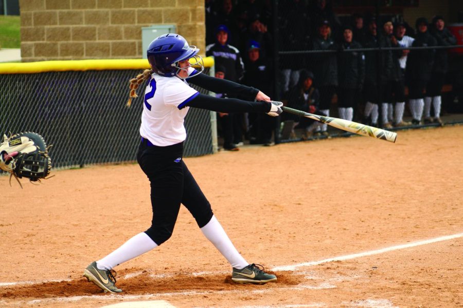 Sophomore utility Sophia Kinjerski takes a swing to try and earn a hit against the University of Wisconsin - Oshkosh at the Van Steenderen Complex Apr. 15, 2022.