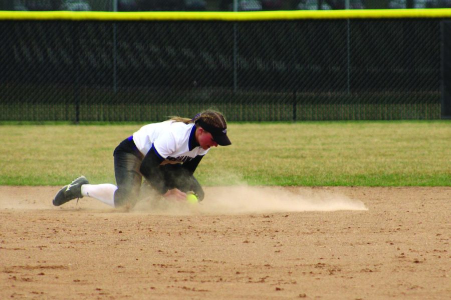 Sophomore shortstop Meghan Dunning gets down in the dirt to stop a ground ball hit by an athlete from the University of Wisconsin - Oshkosh in their home game Apr. 15, 2022.