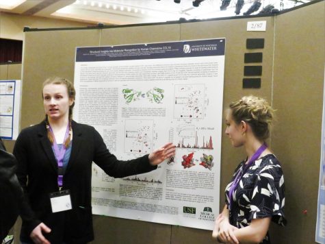 Robin Witt and Alyssa Hintz present a Department of Biochemistry project at the UW System Symposium for Undergraduate Research during a poster session in the Hamilton Room of the University Center Friday, April 22, 2022.