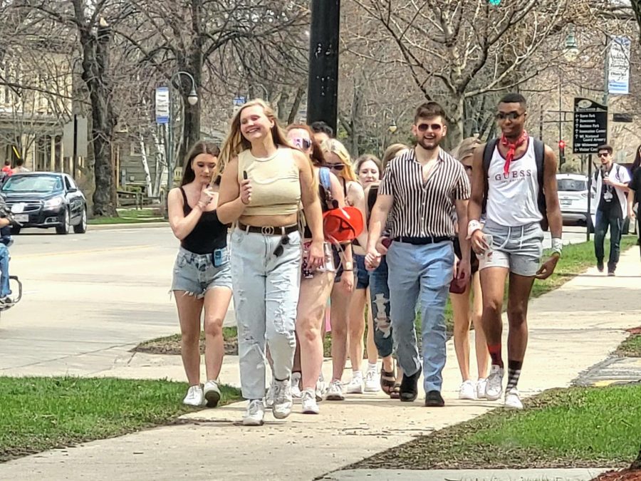 A group of fashionable friends making their way down the street towards one of the many parties going on during Spring Splash.