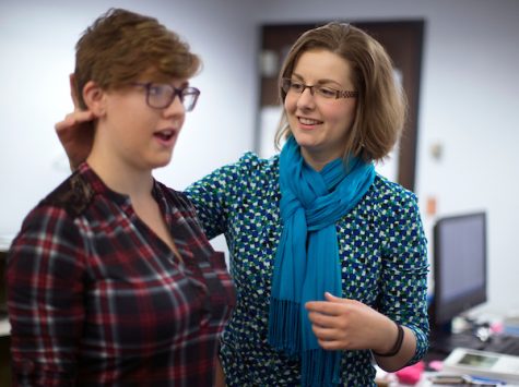 Dr. Rachel Wood assists a student in learning proper vocal techniques. 