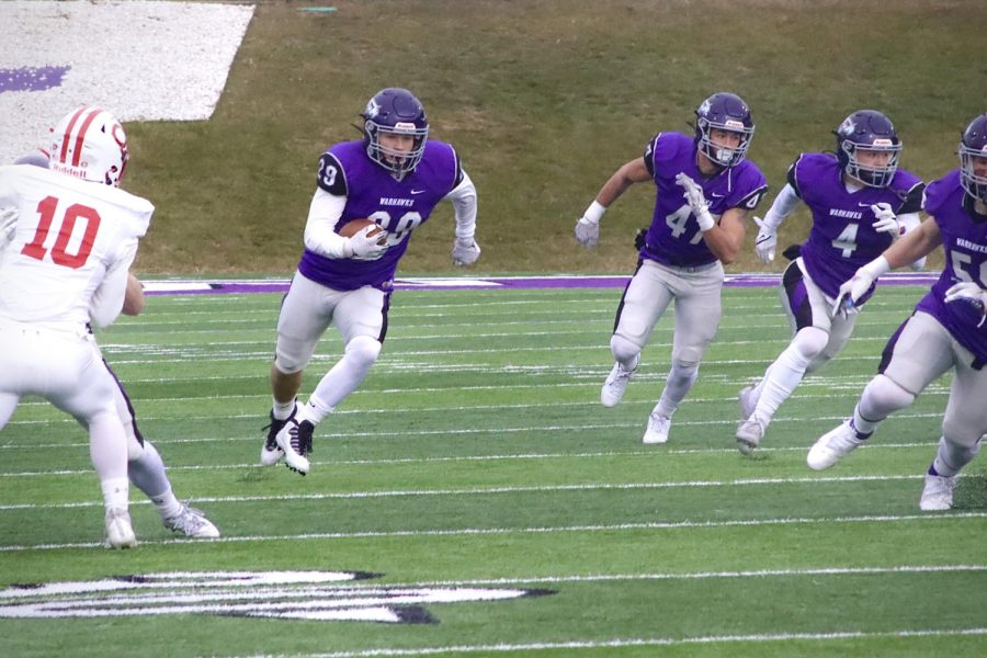 Senior Defensive back Mark McGrath (29) darts across the field escaping from University of Central’s players with the ball Saturday Dec. 4, 2021.