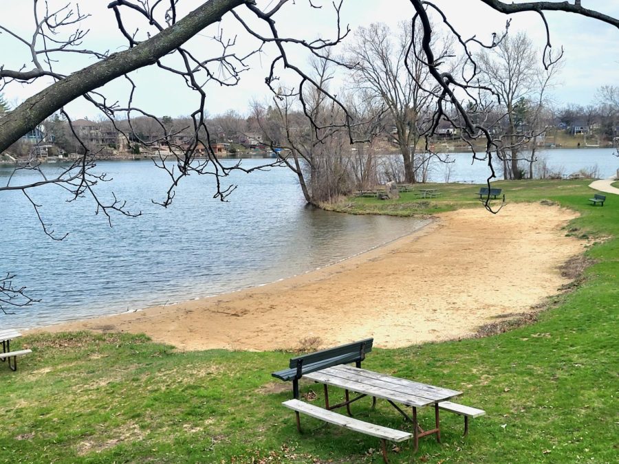 The water on Whitewater lake is calm on a sunny afternoon.
