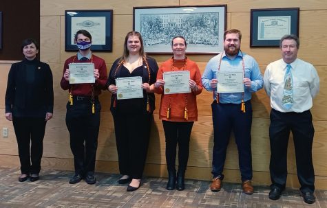 New members proudly show their membership certificates at the UW-W National German Honor Society initiation ceremony April, 2 2022. 