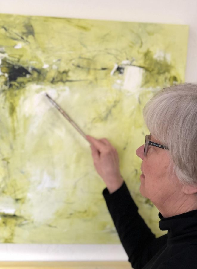 Karolyn Alexander paints in her studio, where she creates everything from acrylic abstract, water paintings, and more. 