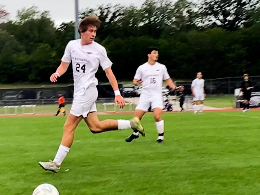 Adam Kaup, Freshman, from Wisconsin Rapids, WI chases the soccer ball, to save the play. Dominic Mudlaff, Sophomore, from Muskego, WI, spots Adam, as they continue to play the soccer game against Alma, at Fiskum Field.