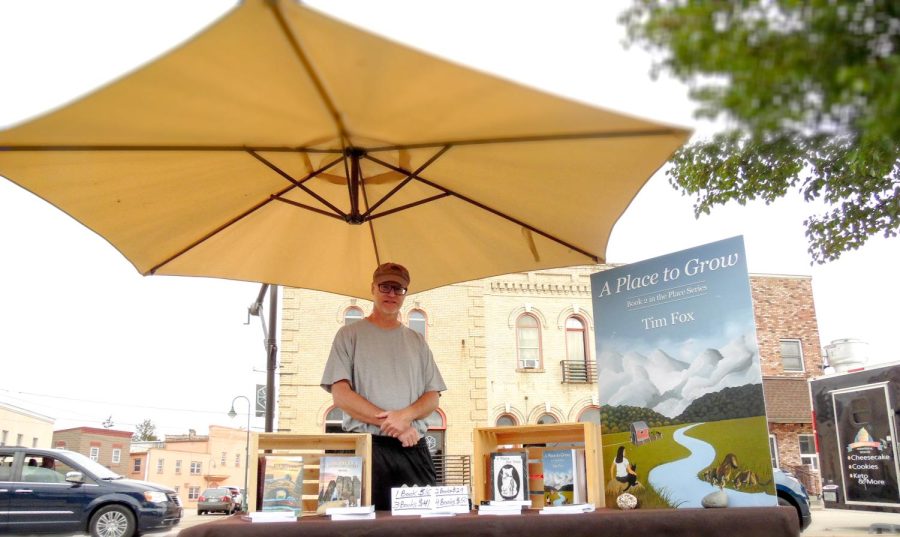 Tim Fox promotes his books, at Cravath Lakefront Park, for Whitewater’s Storytelling Festival.
