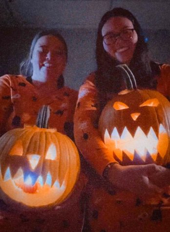 After a trip to the pumpkin patch, graduate student Molly Burger and her girlfriend Kelsey Pacetti proudly show off their jack-lanterns while wearing Halloween pajamas. 
