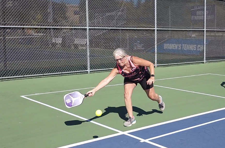 Resident+of+Beloit%2C+WI+Shelly+Cronin+dives+for+the+ball+during+the+7th+match+of+the+UWW+Pickleball+Tournament.+This+was+Cronin%E2%80%99s+first+time+competing+at+an+event+at+UW-Whitewater.%0A